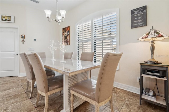 1275 Blue Lake Cir, Punta Gorda, FL 33983 - dining room featuring a chandelier and baseboards
