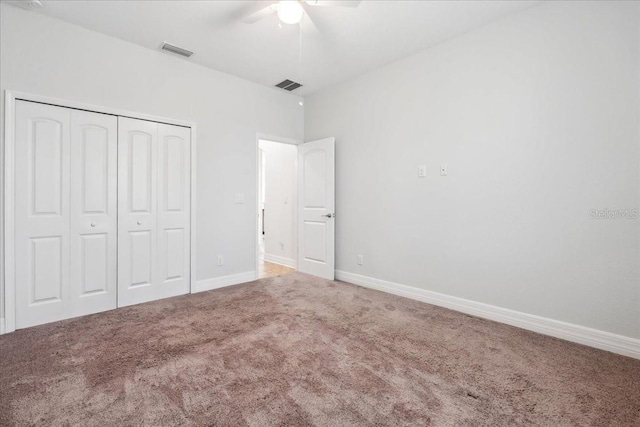 1275 Blue Lake Cir, Punta Gorda, FL 33983 - unfurnished bedroom with carpet flooring, a closet, and a ceiling fan