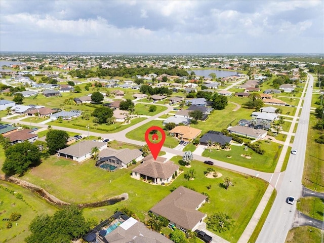 1275 Blue Lake Cir, Punta Gorda, FL 33983 - aerial view of property and surrounding area featuring a large body of water and nearby suburban area