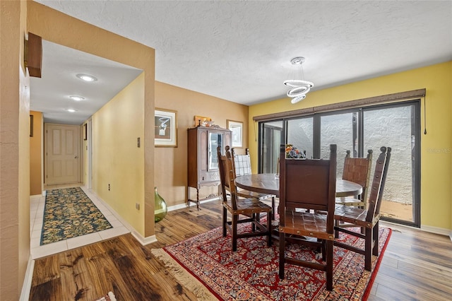 25188 Marion Ave Unit 45, Punta Gorda, FL 33950 - dining room with wood finished floors and a textured ceiling