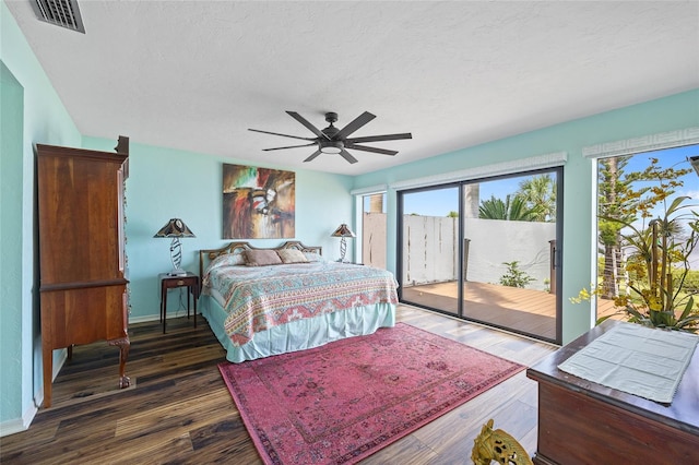 25188 Marion Ave Unit 45, Punta Gorda, FL 33950 - bedroom featuring access to exterior, wood finished floors, a textured ceiling, and a ceiling fan