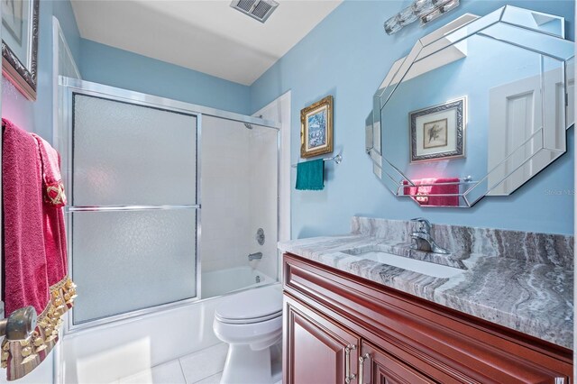 25188 Marion Ave Unit 45, Punta Gorda, FL 33950 - bathroom featuring vanity, enclosed tub / shower combo, and tile patterned flooring
