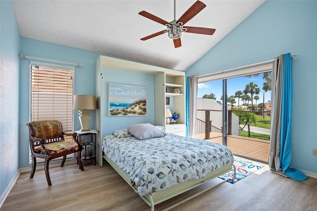 25188 Marion Ave Unit 45, Punta Gorda, FL 33950 - bedroom with access to exterior, wood finished floors, vaulted ceiling, and ceiling fan