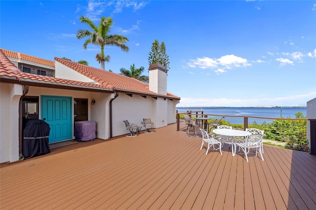 25188 Marion Ave Unit 45, Punta Gorda, FL 33950 - deck featuring outdoor dining space, a water view, and a grill