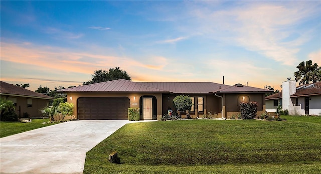 21460 Sheldon Ave, Port Charlotte, FL 33952 - ranch-style home with stucco siding, a lawn, concrete driveway, and an attached garage
