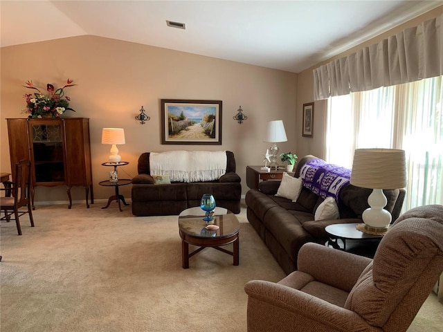 21460 Sheldon Ave, Port Charlotte, FL 33952 - living room featuring plenty of natural light, vaulted ceiling, and light carpet