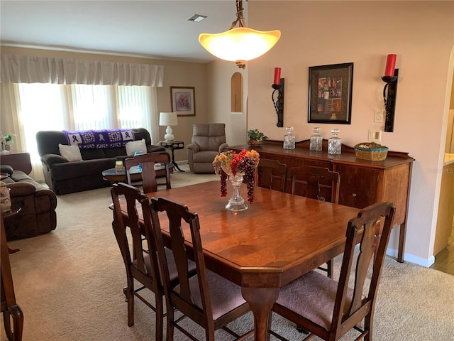 21460 Sheldon Ave, Port Charlotte, FL 33952 - dining space with light carpet and arched walkways