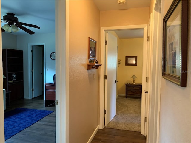 21460 Sheldon Ave, Port Charlotte, FL 33952 - hall featuring dark wood-style floors and baseboards