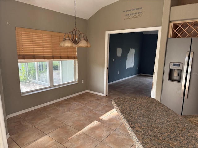 2143 Santonian Ter, North Port, FL 34286 - unfurnished dining area featuring vaulted ceiling, a chandelier, and tile patterned floors
