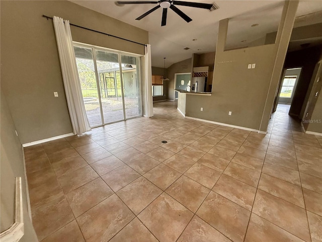 2143 Santonian Ter, North Port, FL 34286 - unfurnished living room with lofted ceiling, a ceiling fan, and light tile patterned floors