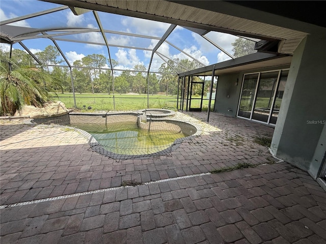 2143 Santonian Ter, North Port, FL 34286 - view of patio / terrace featuring a pool with connected hot tub and a lanai