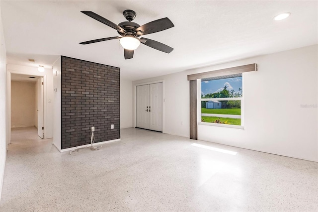 3497 Cohoes St, Port Charlotte, FL 33952 - unfurnished living room with speckle patterned floor and a ceiling fan