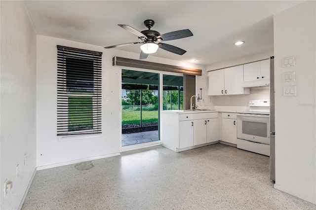 3497 Cohoes St, Port Charlotte, FL 33952 - kitchen featuring white range with electric cooktop, under cabinet range hood, white cabinetry, light countertops, and a ceiling fan