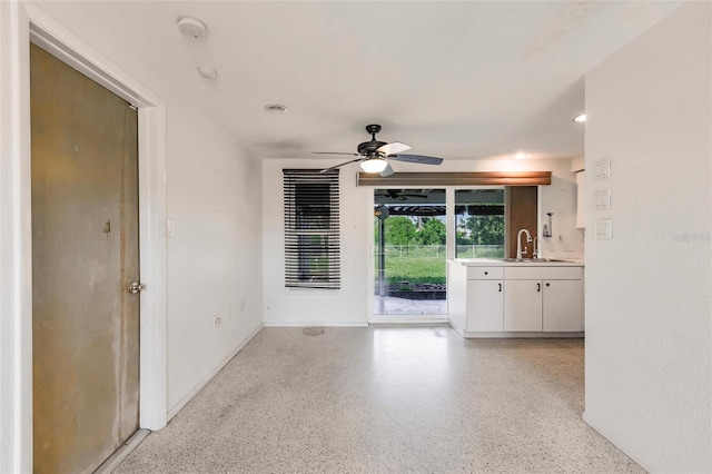 3497 Cohoes St, Port Charlotte, FL 33952 - unfurnished living room featuring a ceiling fan, dark aggregate flooring, and recessed lighting