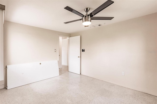 3497 Cohoes St, Port Charlotte, FL 33952 - spare room with speckle patterned floor and a ceiling fan