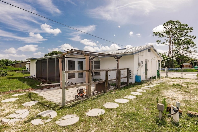 3497 Cohoes St, Port Charlotte, FL 33952 - back of property with a sunroom and a patio