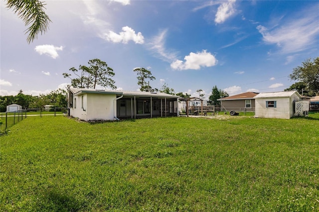 3497 Cohoes St, Port Charlotte, FL 33952 - fenced backyard with a sunroom and a storage shed