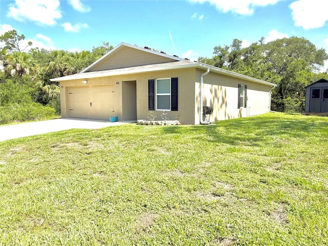 17344 York Ave, Port Charlotte, FL 33948 - view of front of property with stucco siding, a garage, driveway, a front yard, and a storage unit