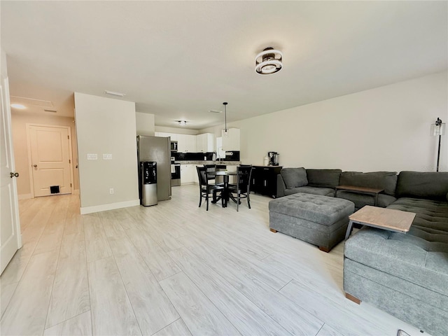 17344 York Ave, Port Charlotte, FL 33948 - living room with light wood-style flooring and baseboards