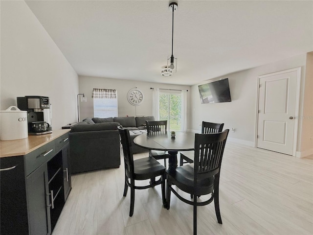 17344 York Ave, Port Charlotte, FL 33948 - dining space with baseboards and light wood-style flooring