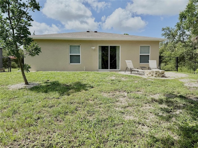 17344 York Ave, Port Charlotte, FL 33948 - rear view of house with stucco siding and a patio area