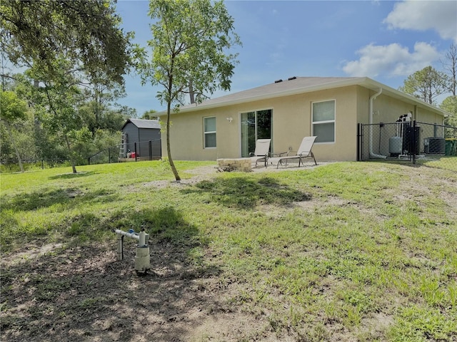 17344 York Ave, Port Charlotte, FL 33948 - back of house featuring stucco siding and a fenced backyard