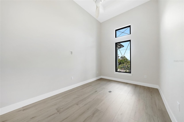 2815 Coral Way, Punta Gorda, FL 33950 - spare room with light wood-type flooring, high vaulted ceiling, and a ceiling fan