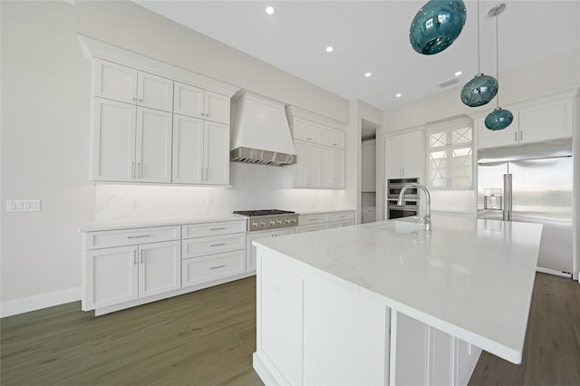 2815 Coral Way, Punta Gorda, FL 33950 - kitchen featuring wall chimney exhaust hood, appliances with stainless steel finishes, dark wood-style flooring, white cabinets, and recessed lighting