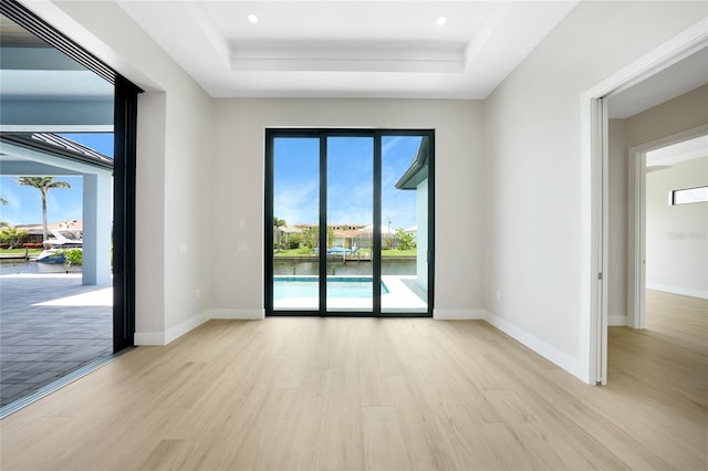 2815 Coral Way, Punta Gorda, FL 33950 - spare room with light wood-type flooring, a raised ceiling, and recessed lighting