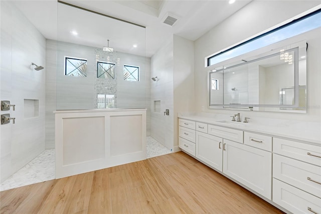 2815 Coral Way, Punta Gorda, FL 33950 - full bath with walk in shower, a chandelier, vanity, recessed lighting, and wood finished floors
