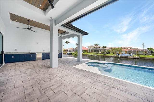2815 Coral Way, Punta Gorda, FL 33950 - view of pool with ceiling fan, a water view, a patio area, and a pool with connected hot tub