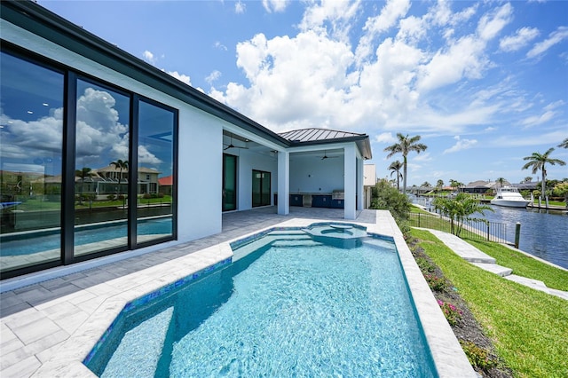 2815 Coral Way, Punta Gorda, FL 33950 - view of pool featuring ceiling fan, a patio area, a water view, and a pool with connected hot tub
