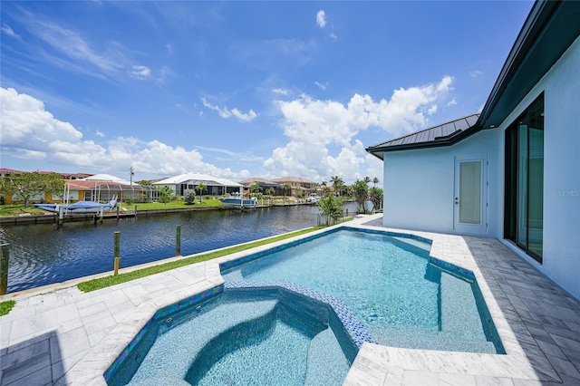 2815 Coral Way, Punta Gorda, FL 33950 - view of swimming pool with a water view, a pool with connected hot tub, and a patio area