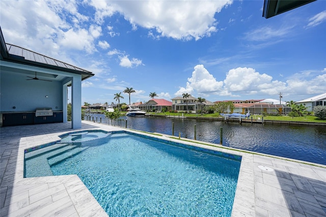 2815 Coral Way, Punta Gorda, FL 33950 - view of pool with exterior kitchen, a ceiling fan, a water view, a patio area, and a residential view