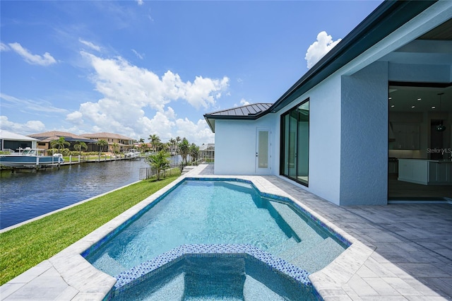 2815 Coral Way, Punta Gorda, FL 33950 - view of pool featuring a water view, a patio, and a pool with connected hot tub
