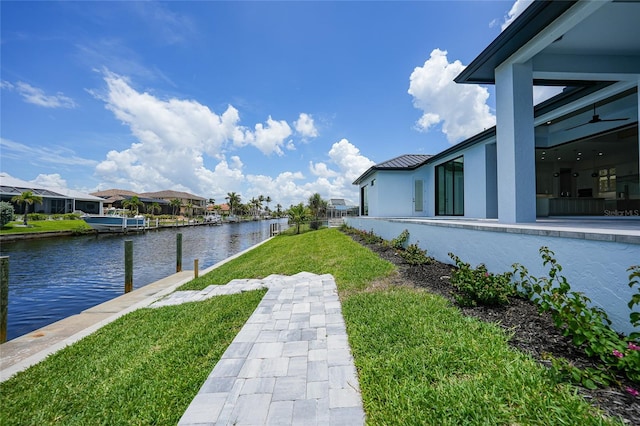 2815 Coral Way, Punta Gorda, FL 33950 - view of green lawn featuring a water view, a boat dock, and a residential view