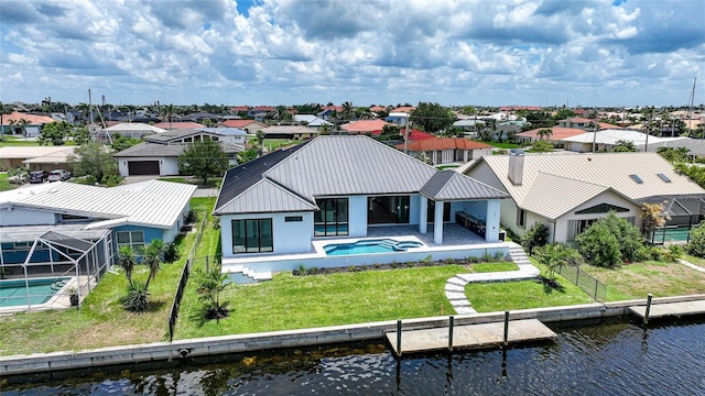 2815 Coral Way, Punta Gorda, FL 33950 - back of property with a residential view, a metal roof, an outdoor pool, and a water view
