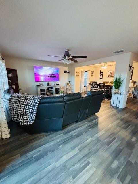 6766 N Pavilion Loop, Citrus Springs, FL 34433 - living room featuring wood finished floors and a ceiling fan