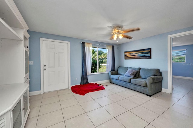 25082 Harborview Rd, Punta Gorda, FL 33980 - living area featuring healthy amount of natural light, ceiling fan, and light tile patterned floors