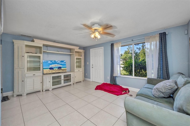 25082 Harborview Rd, Punta Gorda, FL 33980 - living room with a ceiling fan and light tile patterned floors