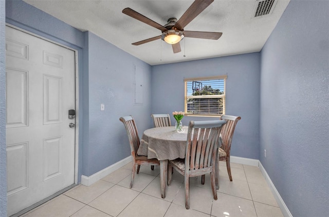 25082 Harborview Rd, Punta Gorda, FL 33980 - dining area with a ceiling fan and light tile patterned floors