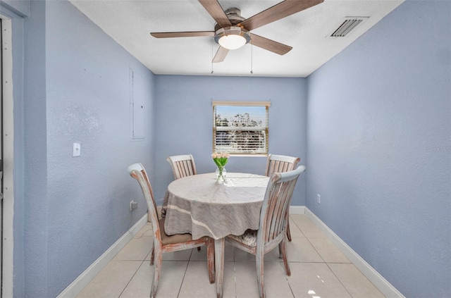 25082 Harborview Rd, Punta Gorda, FL 33980 - dining space featuring ceiling fan and light tile patterned flooring