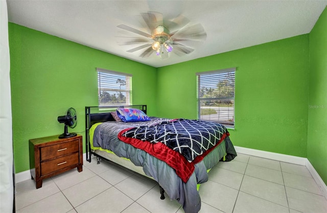 25082 Harborview Rd, Punta Gorda, FL 33980 - tiled bedroom with multiple windows and ceiling fan