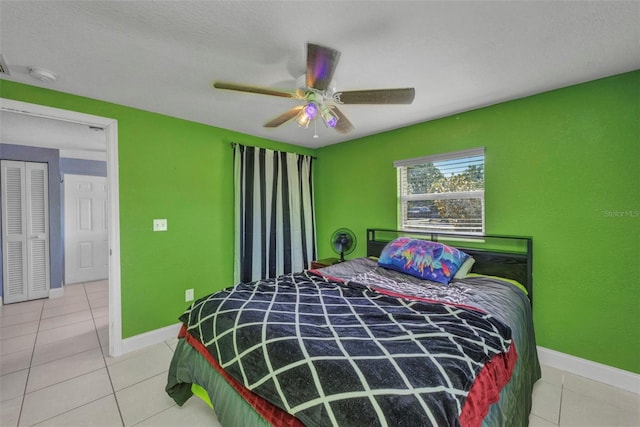 25082 Harborview Rd, Punta Gorda, FL 33980 - bedroom with light tile patterned floors and ceiling fan