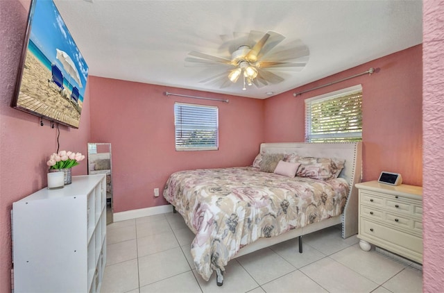 25082 Harborview Rd, Punta Gorda, FL 33980 - bedroom with light tile patterned flooring and ceiling fan