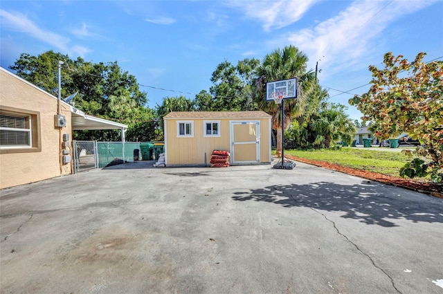 25082 Harborview Rd, Punta Gorda, FL 33980 - view of patio with a storage unit and a gate