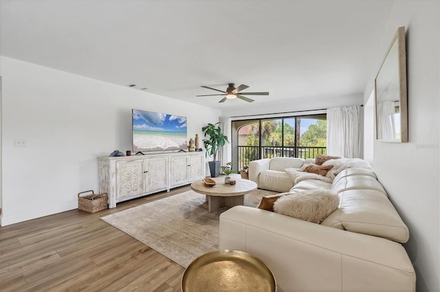 23465 Harborview Rd Unit 1031, Punta Gorda, FL 33980 - living area with ceiling fan and wood finished floors