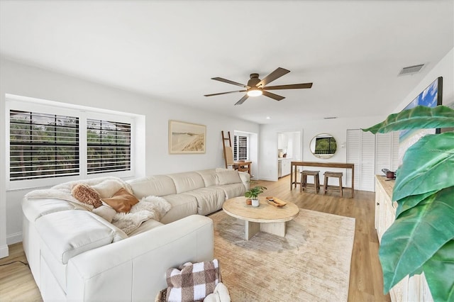 23465 Harborview Rd Unit 1031, Punta Gorda, FL 33980 - living room with a ceiling fan and light wood-style flooring