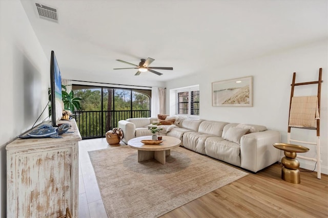 23465 Harborview Rd Unit 1031, Punta Gorda, FL 33980 - living area with ceiling fan and wood finished floors