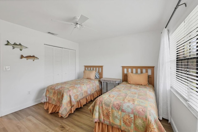 23465 Harborview Rd Unit 1031, Punta Gorda, FL 33980 - bedroom with a closet, wood finished floors, and a ceiling fan